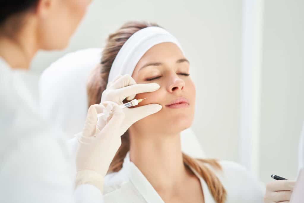 Close-up scene of medical cosmetology treatment with Botox injection for wrinkle reduction and facial rejuvenation